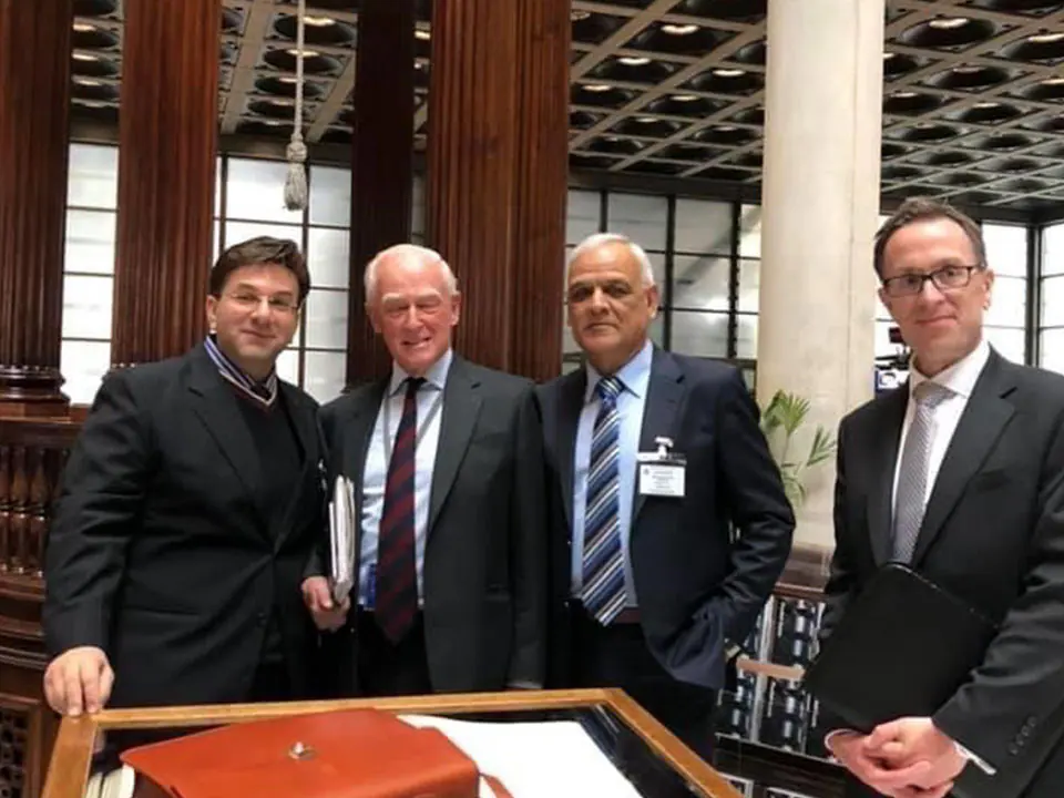 Rizwan Masoom Ali with reinsurance colleagues in the Underwriting Room at Lloyd’s of London